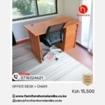 Executive office desk paired with a black ergonomic mesh chair in a modern workspace setup