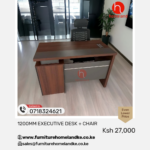 Modern 1.2m executive desk paired with ergonomic office chair featuring adjustable headrest and lumbar support