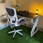 : Executive Metallic Desk with White Ergonomic Chair for Stylish and Comfortable Workspaces