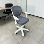 White and grey ergonomic mesh office chair with armrests and swivel wheels
