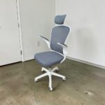 Grey highback ergonomic office chair with headrest and white frame