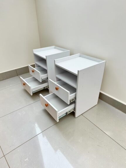 White bedside drawer with storage drawers and wooden handles